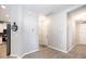 View from the hall to the kitchen, complete with stainless steel appliances at 4189 Marseille Ln, Lakeland, FL 33810