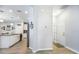 View of the kitchen from the hall, complete with stainless steel appliances at 4189 Marseille Ln, Lakeland, FL 33810