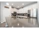 Modern kitchen showcasing stainless steel appliances, gray countertops, and updated backsplash at 4189 Marseille Ln, Lakeland, FL 33810
