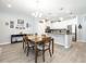 Open-concept kitchen boasts stainless steel appliances, granite countertops, and ample storage at 4189 Marseille Ln, Lakeland, FL 33810