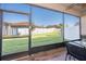 View from the screened patio looking out over the fenced in yard and landscaping at 4189 Marseille Ln, Lakeland, FL 33810