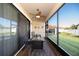 Comfortable screened patio with ceiling fan, ideal for outdoor dining and relaxation with backyard view at 4189 Marseille Ln, Lakeland, FL 33810