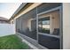Screened-in patio with neutral walls, a ceiling fan, and views of the backyard at 4189 Marseille Ln, Lakeland, FL 33810