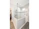Corner shower features clear glass surround, accent tile, and grab bar at 4189 Marseille Ln, Lakeland, FL 33810