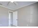 Neutral bedroom featuring light grey walls, wood-look flooring, a doorway, and trim at 4228 Sunny Land Dr, Lakeland, FL 33813