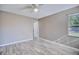 Bright bedroom featuring wood-look tile flooring and a ceiling fan at 4228 Sunny Land Dr, Lakeland, FL 33813