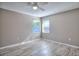 Bedroom featuring a ceiling fan, wood-look flooring, and windows with natural lighting at 4228 Sunny Land Dr, Lakeland, FL 33813