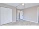 Neutral bedroom showcasing wood-look tile, a closet, and ceiling fan at 4228 Sunny Land Dr, Lakeland, FL 33813