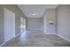 Open-concept living room with a breakfast bar, wood-look tile flooring and sliding glass doors to the backyard at 4228 Sunny Land Dr, Lakeland, FL 33813