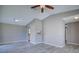 Open-concept living room with a breakfast bar and wood-look tile flooring at 4228 Sunny Land Dr, Lakeland, FL 33813