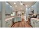 This kitchen has stainless steel appliances and wood floors at 4488 Whistlewood Cir, Lakeland, FL 33811