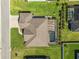 Aerial image of the home showcasing the roof, screened pool, and landscaping at 5020 Truman Ln, Lakeland, FL 33812