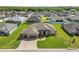 Beautiful aerial view of the residence showcasing the roof, driveway, and lush landscaping at 5020 Truman Ln, Lakeland, FL 33812