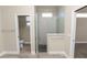 Modern bathroom with glass shower enclosure, tile accents, and neutral color palette at 5020 Truman Ln, Lakeland, FL 33812