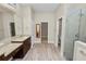 Luxurious bathroom features dual vanities, walk-in closet, and a glass-enclosed shower at 5020 Truman Ln, Lakeland, FL 33812