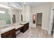 Luxurious bathroom features dual vanities, walk-in closet, and a glass-enclosed shower at 5020 Truman Ln, Lakeland, FL 33812