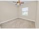 Cozy bedroom showcasing carpet floors, a window, and neutral paint at 5020 Truman Ln, Lakeland, FL 33812