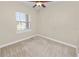 Sunlit bedroom with carpeted flooring and a large window, creating a cozy and inviting space at 5020 Truman Ln, Lakeland, FL 33812