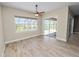 An empty bonus room with wood-look tile and a large window overlooking the pool at 5020 Truman Ln, Lakeland, FL 33812