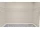 Spacious walk-in closet with ample shelving for optimal organization at 5020 Truman Ln, Lakeland, FL 33812