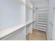 Walk-in closet complete with custom shelving and ample storage space at 5020 Truman Ln, Lakeland, FL 33812