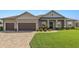 Charming single-story home featuring a well-manicured lawn and a spacious two car garage at 5020 Truman Ln, Lakeland, FL 33812