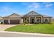 Charming single-story home with a well-manicured lawn, paver driveway and a welcoming entrance at 5020 Truman Ln, Lakeland, FL 33812