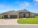 Charming single-story home featuring a well-manicured lawn and a spacious two car garage at 5020 Truman Ln, Lakeland, FL 33812