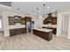 Well-lit kitchen with ample counter space and stainless steel refrigerator at 5020 Truman Ln, Lakeland, FL 33812