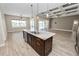 Kitchen island featuring a marble countertop and convenient sink at 5020 Truman Ln, Lakeland, FL 33812