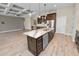 Close-up of the kitchen island with marble countertops and seating at 5020 Truman Ln, Lakeland, FL 33812