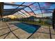 Backyard pool featuring a screened enclosure, blending relaxation and recreation under open skies at 5020 Truman Ln, Lakeland, FL 33812
