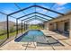 Inviting pool with a spacious patio and screened-in enclosure, ideal for relaxation at 5020 Truman Ln, Lakeland, FL 33812