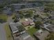 Overhead view of the home highlighting the backyard, screened in patio, mature trees and neighborhood at 5432 Weber Pl, Lakeland, FL 33809