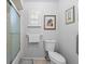 Cozy bathroom with framed art and shower with glass door at 5432 Weber Pl, Lakeland, FL 33809
