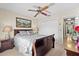 Comfortable bedroom with carpet floors, fan, closet, and lamps at 5432 Weber Pl, Lakeland, FL 33809