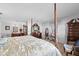 Primary bedroom featuring a large bed, and dresser with a mirror and natural light at 5432 Weber Pl, Lakeland, FL 33809