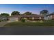Beautifully landscaped brick home showcasing its garage, well-kept lawn, and inviting curb appeal at 5432 Weber Pl, Lakeland, FL 33809