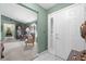 Inviting foyer features tile flooring, a decorative front door, and views of the living area at 5432 Weber Pl, Lakeland, FL 33809