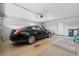 Spacious garage with car and a door to the outside at 5432 Weber Pl, Lakeland, FL 33809