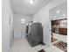 Spacious laundry room with a washer and dryer, tiled floor, and natural light at 5432 Weber Pl, Lakeland, FL 33809