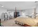 Inviting main bedroom with four-poster bed, neutral decor, and ample natural light at 5432 Weber Pl, Lakeland, FL 33809