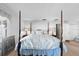 Beautiful main bedroom featuring a four-poster bed and neutral decor at 5432 Weber Pl, Lakeland, FL 33809
