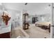 Light and airy main bedroom featuring a four-poster bed and ensuite bathroom at 5432 Weber Pl, Lakeland, FL 33809
