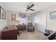 Cozy office with desk, chair, closet, window, and overhead fan at 5432 Weber Pl, Lakeland, FL 33809