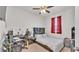 Bedroom featuring a desk, chair, and a large window; pink carpet present at 5742 Arlington River Dr, Lakeland, FL 33811