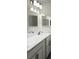Bright bathroom featuring a double sink vanity with white cabinets and modern lighting at 5752 Anders Way, St Cloud, FL 34771