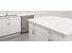 Close-up on kitchen island featuring marble countertops and sleek hardware at 5752 Anders Way, St Cloud, FL 34771