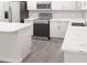 Modern kitchen showcasing stainless steel appliances, white cabinets, and marble countertops at 5752 Anders Way, St Cloud, FL 34771