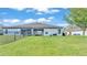A well-maintained yard is fully fenced and has a covered porch and room for outdoor games at 5883 Great Salt Ct, Lakeland, FL 33805